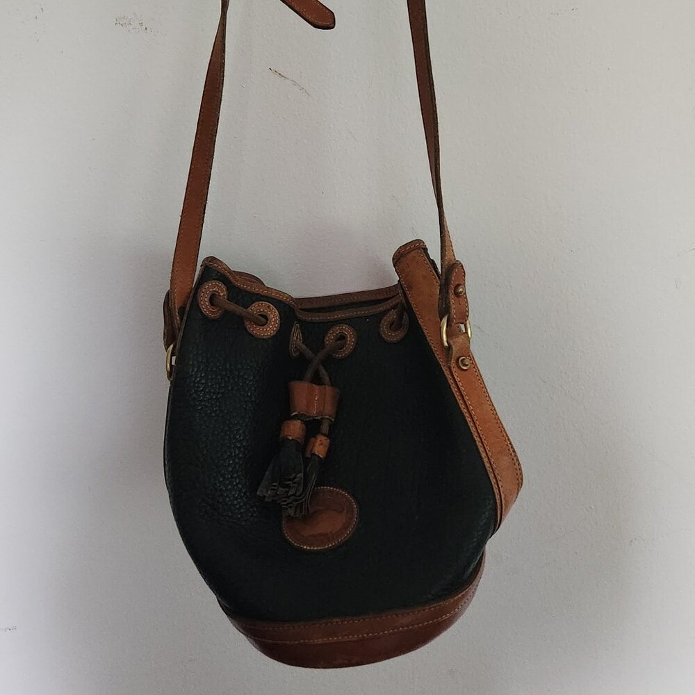 Dooney & Bourke black and cognac leather bucket bag